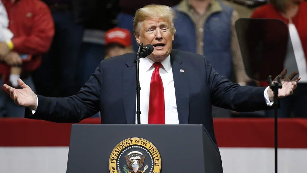 President Donald Trump speaks at a rally Sunday.