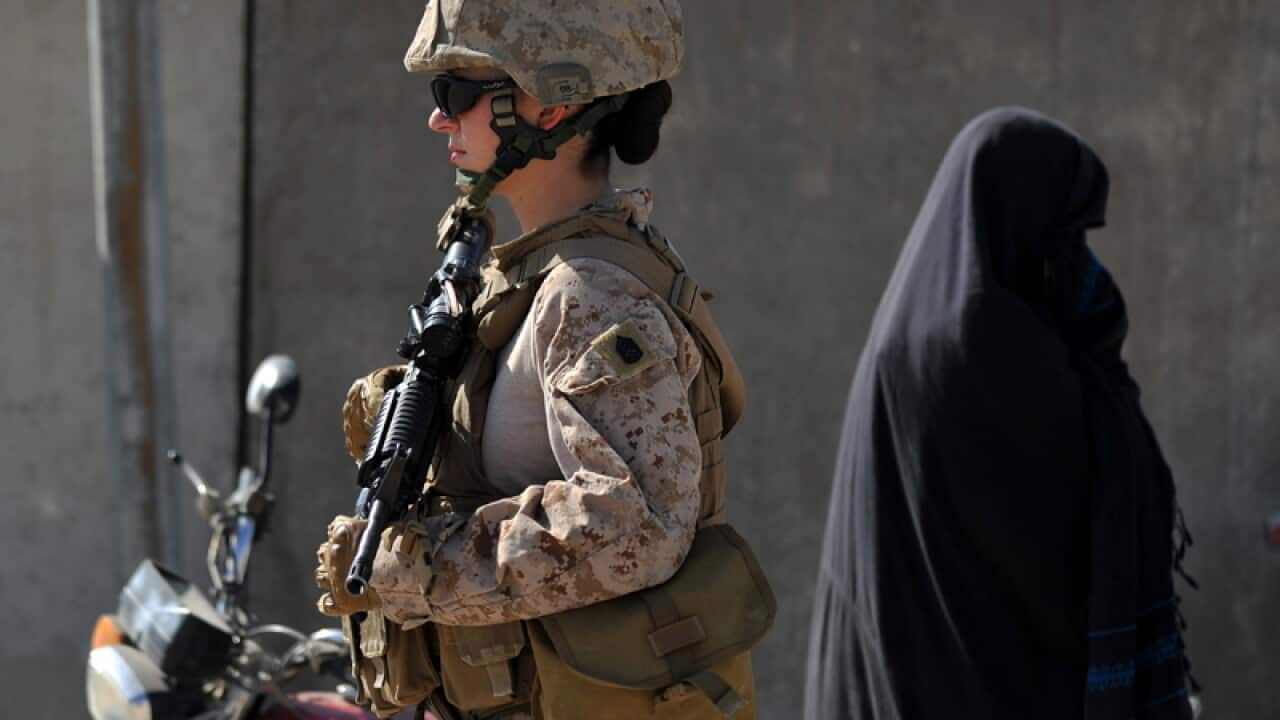 US women in Afghanistan are serving in support units as truck drivers, gunners, medics, military police, helicopter pilots and more. (Getty Images)