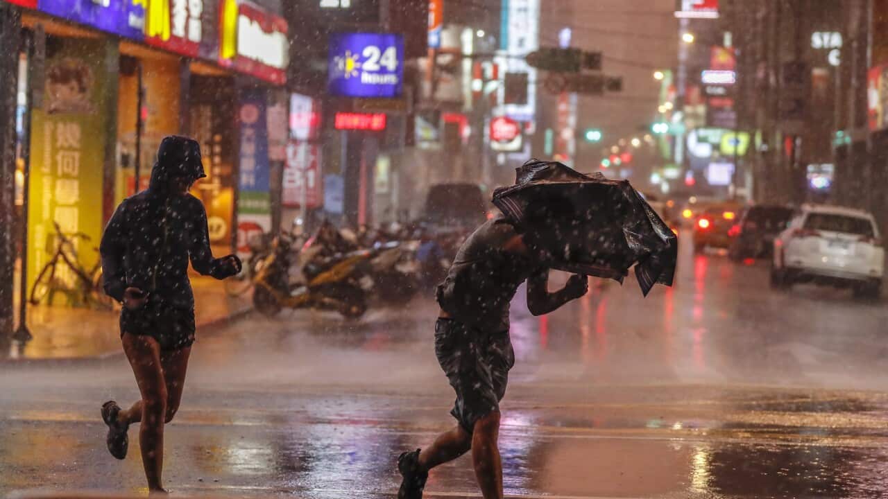 Typhoons regularly hit Taiwan this time of the year. Last year people ran during a downpour of rain brought by typhoon Maria.