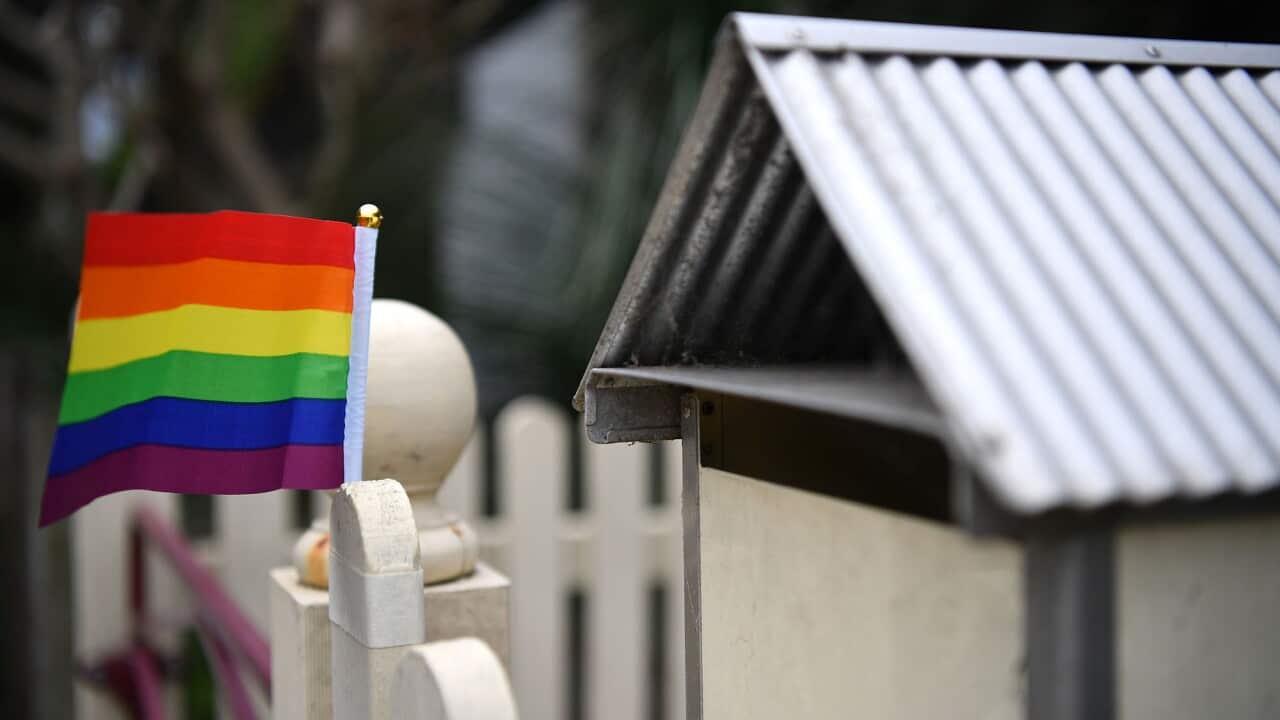 A rainbow flag in support of a Yes vote in the marriage equality postal survey is seen on a fence in Sydney's inner west, Tuesday, October 3, 2017. (AAP Image/Joel Carrett) NO ARCHIVING
