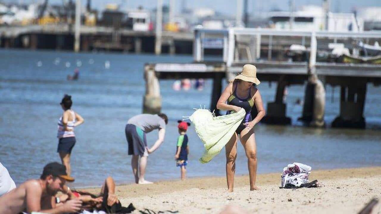 Mid morning beach goers at Port Melbourne beach in Melbourne, ahead of a predicted 42 degree scorcher. Saturday, 6 January, 2018.