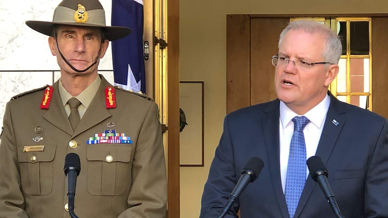 Prime Minister Scott Morrison (right) and Defence Force chief Angus Campbell announce Australia will send troops to the Strait of Hormuz.