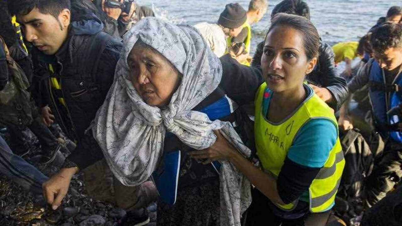 Refugees from Syria, Afghanistan and Iraq arrive in Greece from Turkey.