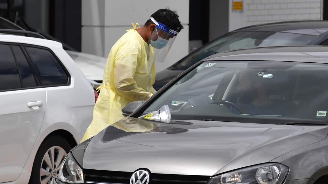 A health worker conducts COVID-19 testing at the inner west suburb of Five Dock, Wednesday, December 30, 2020. The inner west of Sydney is on high alert after further cases of Covid-19 have been identified. (AAP Image/Mick Tsikas) NO ARCHIVING