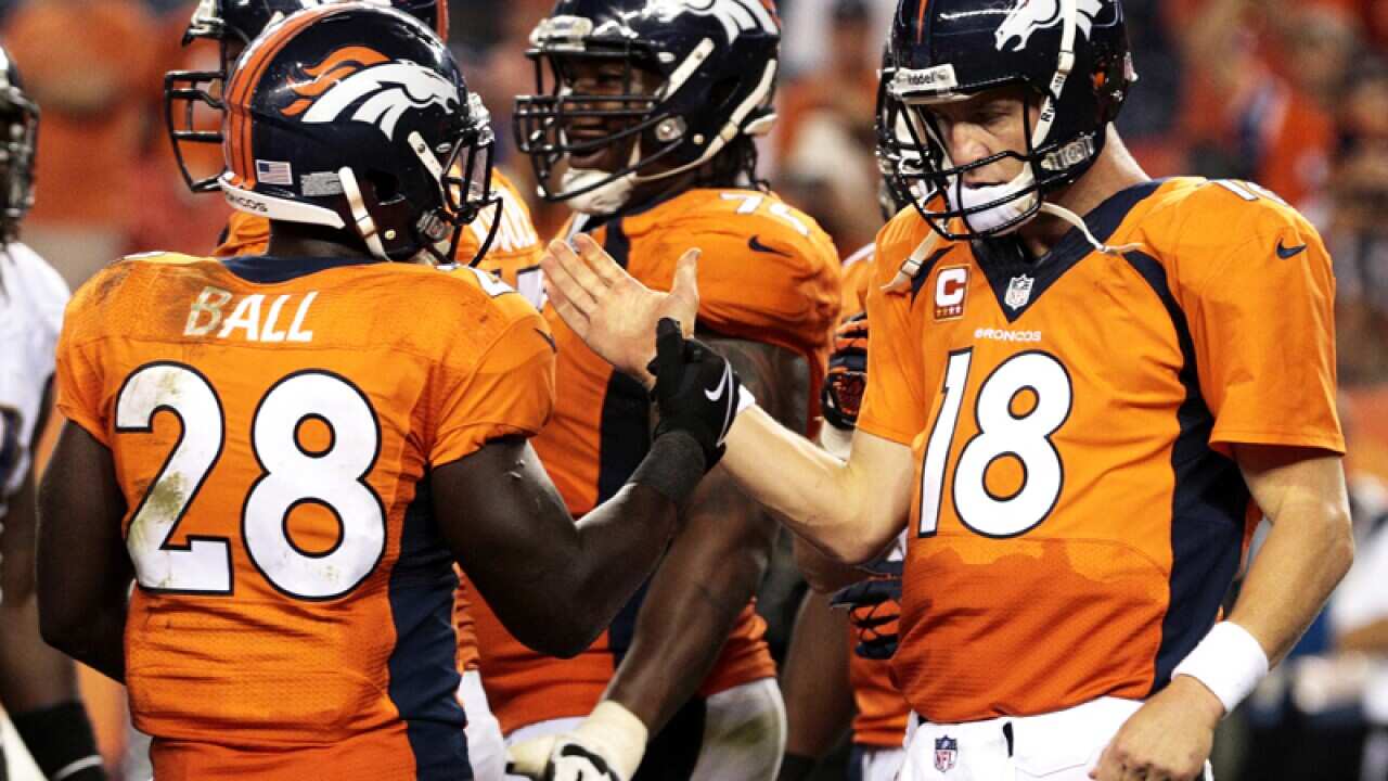 Denver Broncos quarterback Peyton Manning (left)