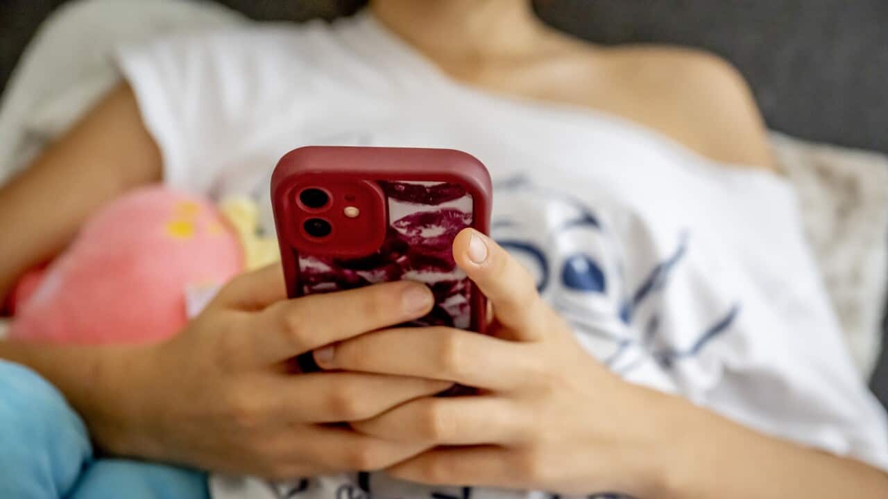 A young woman on her mobile phone (AAP).