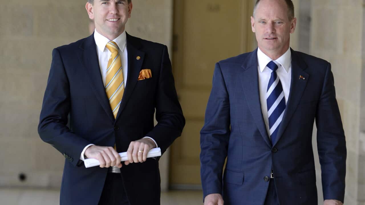 Queensland's attorney-general (L) and premier