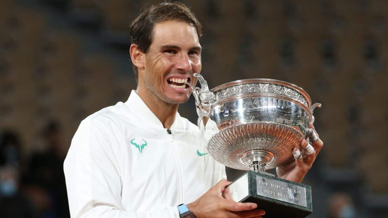 Rafael Nadal celebrates with the French Open title