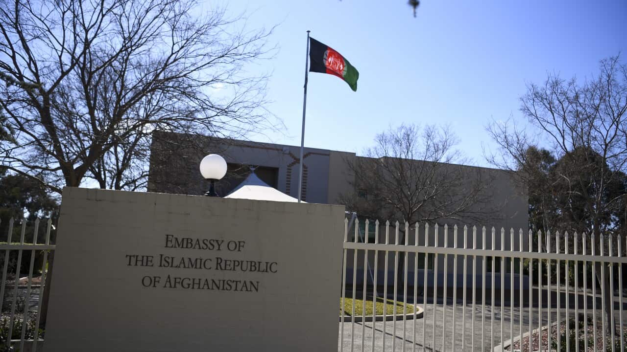 A picture of a building flying the Afghan flag