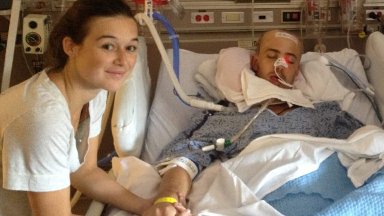 Robert Scott in hospital with his girlfriend.