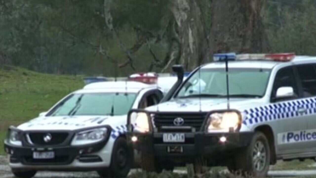 The men, who were shot by police officers, were armed with a knife and tomahawk.