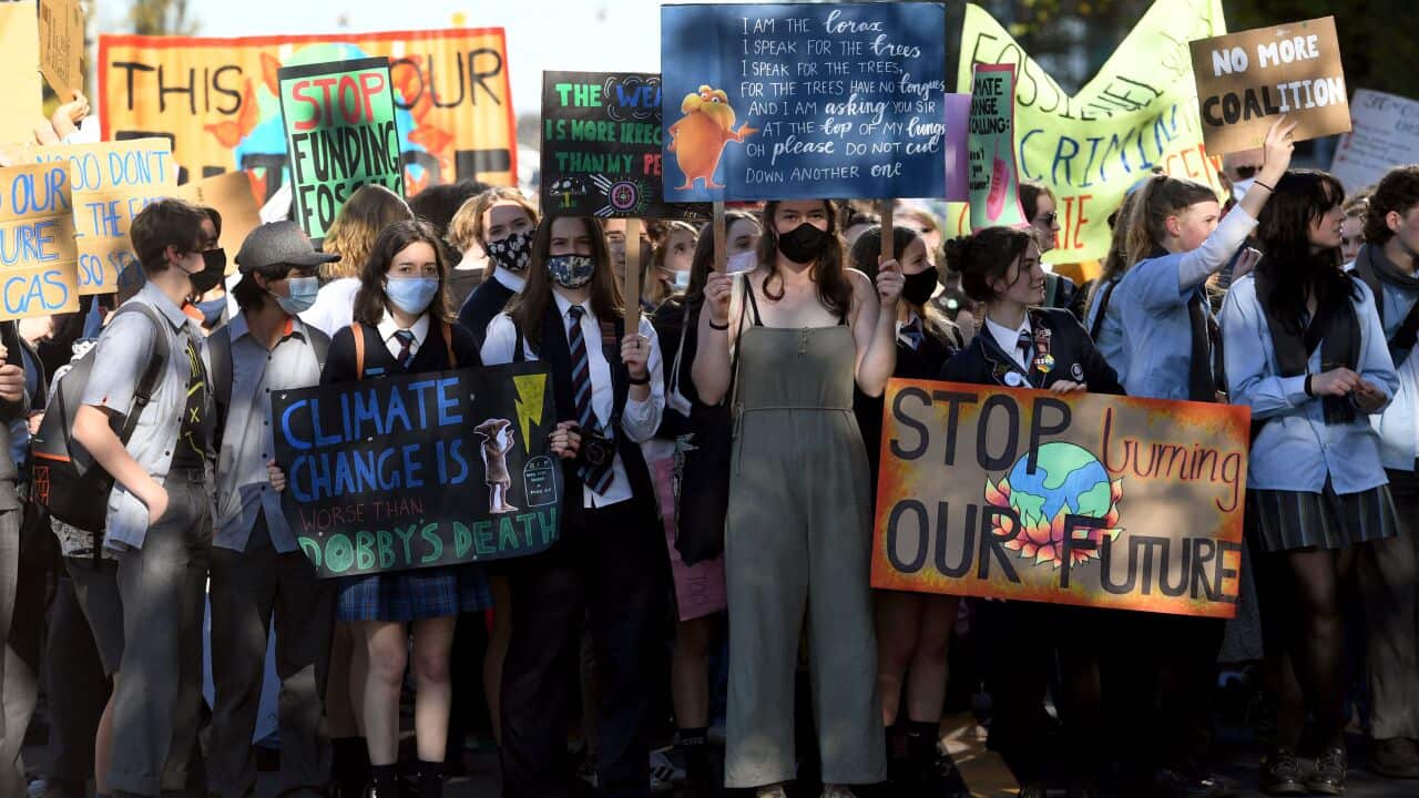 Students march at a School Strike 4 Climate rally during a mass school strike for climate action in Melbourne on May 21, 2021.