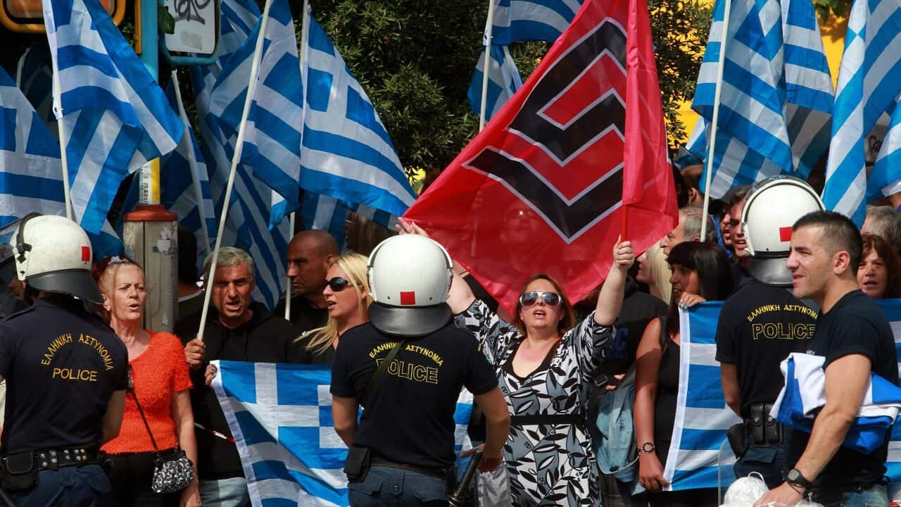 File: Golden Dawn supporters gather outside an Athens courthouse.jpg