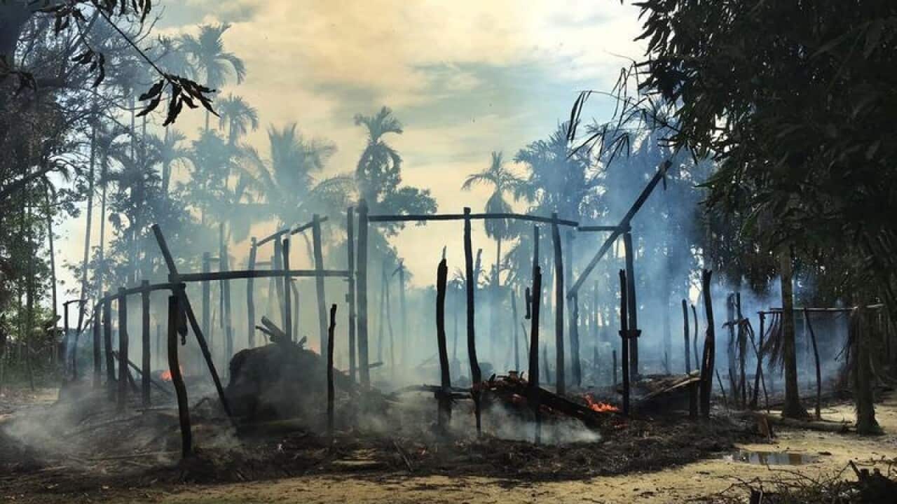 Smoke rises from a burned house in Gawdu Zara village, Myanmar