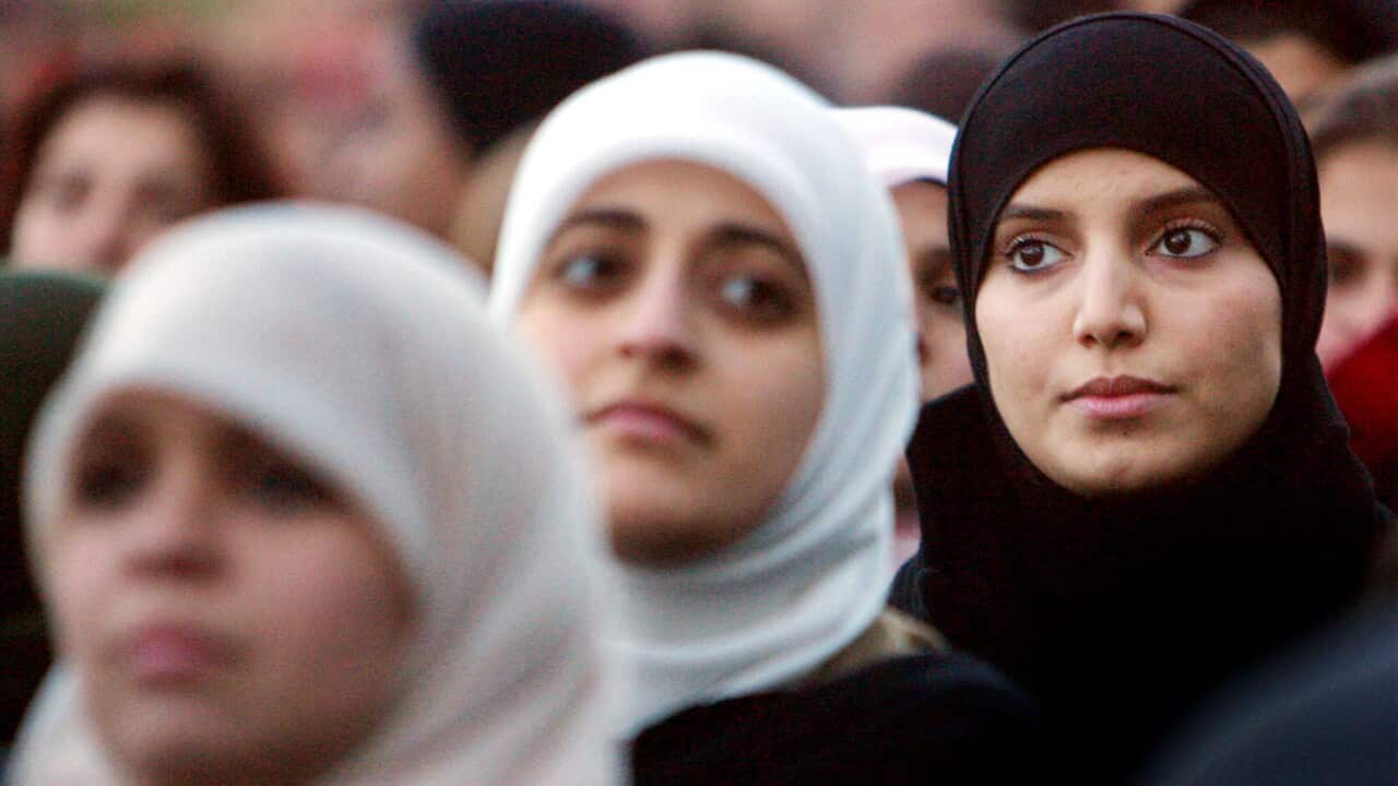 Muslim women attend a protest outside parliament in Copenhagen