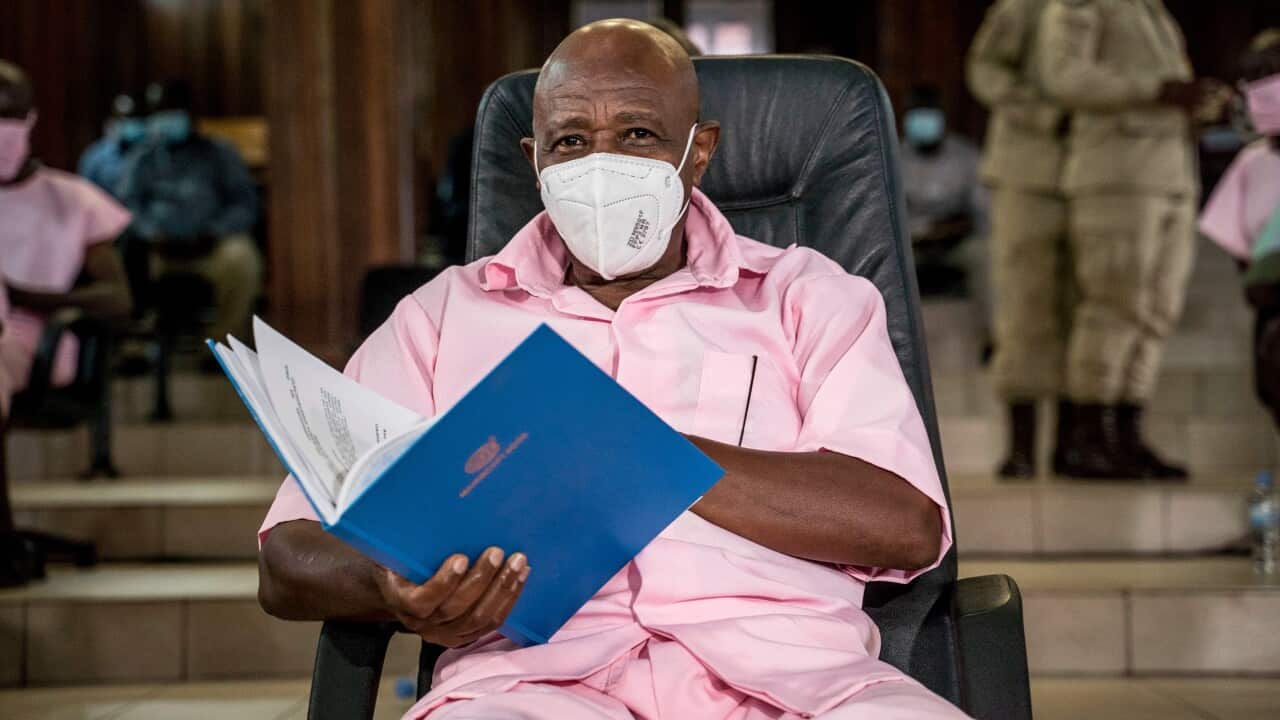 Paul Rusesabagina looks on as he sits with some of his coaccused at the Supreme Court in Kigali on February17, 2021 where he is facing charges of terror