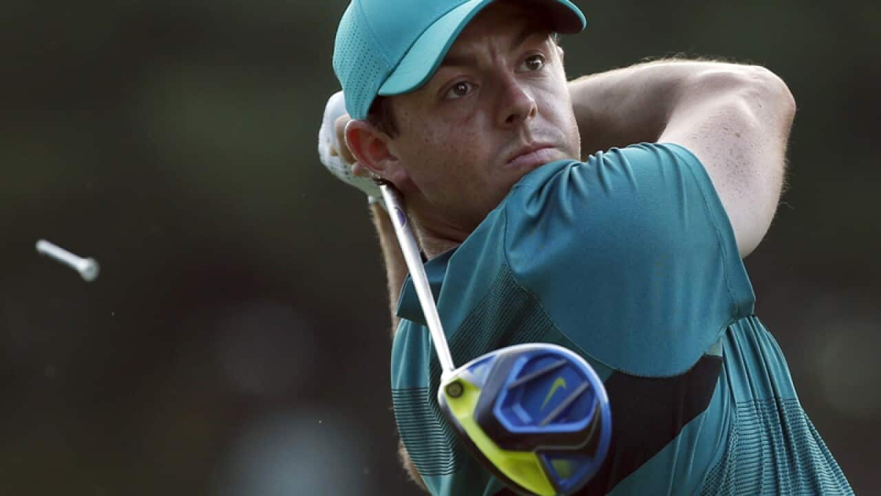 Rory McIlroy watches his tee shot