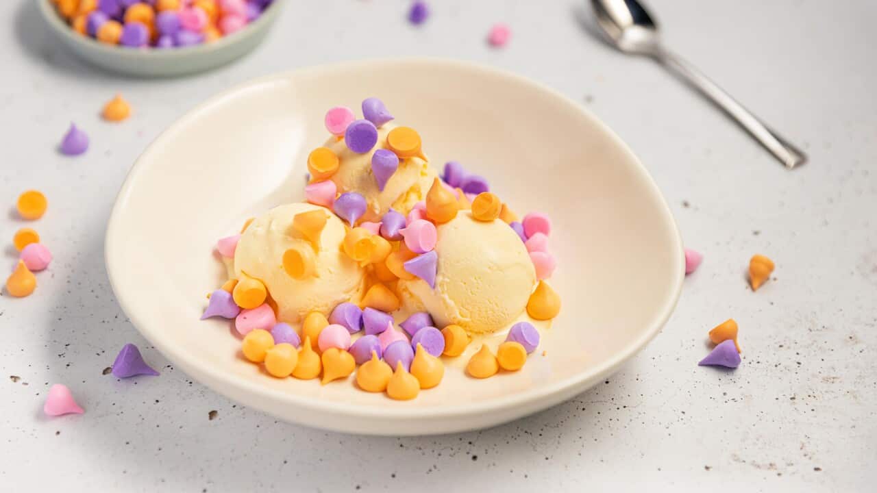 Little pink, purple and orange meringue confetti are a colourful dessert served with ice-cream.