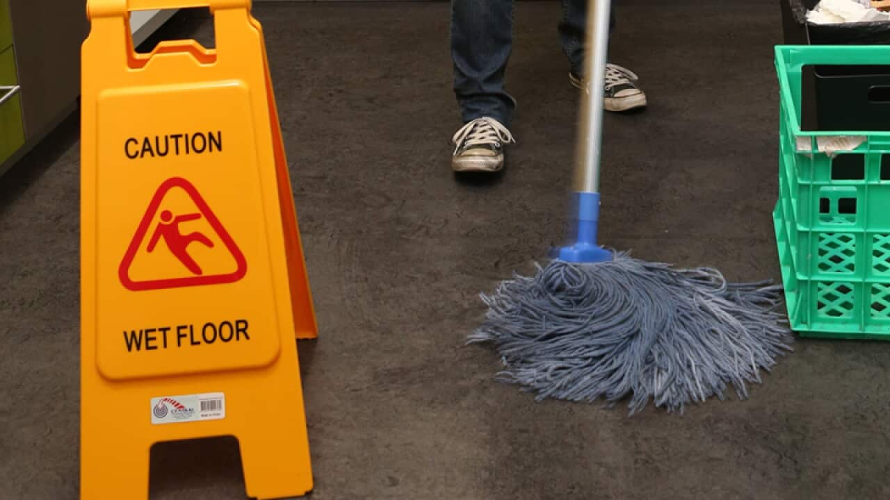 A cleaner cleans a business