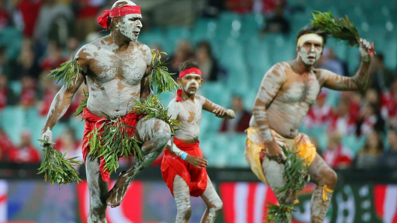 Traditional dancers perform before the AFL Indigenous Round, 2017.