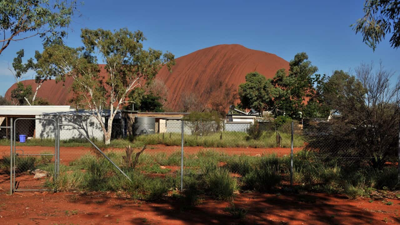 Ulura as seen from the township of Mutitjulu in the Northern Territory on Wednesday, Feb. 10, 2010. (AAP Image/Paul Miller) NO ARCHIVING