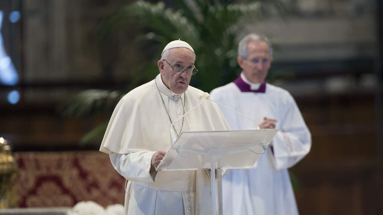 Pope Francis celebrates Easter Sunday Mass inside an empty St. Peter's Basilica, at the Vatican