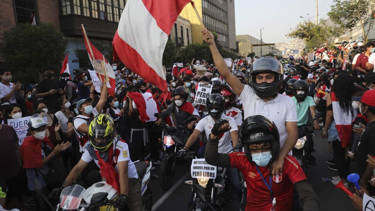 A caravan of demonstrators on motorcycles ride