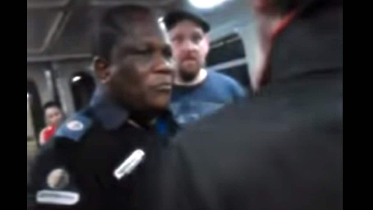 The security guard targeted in a racist rant on board a Brisbane train has been praised for his composure.