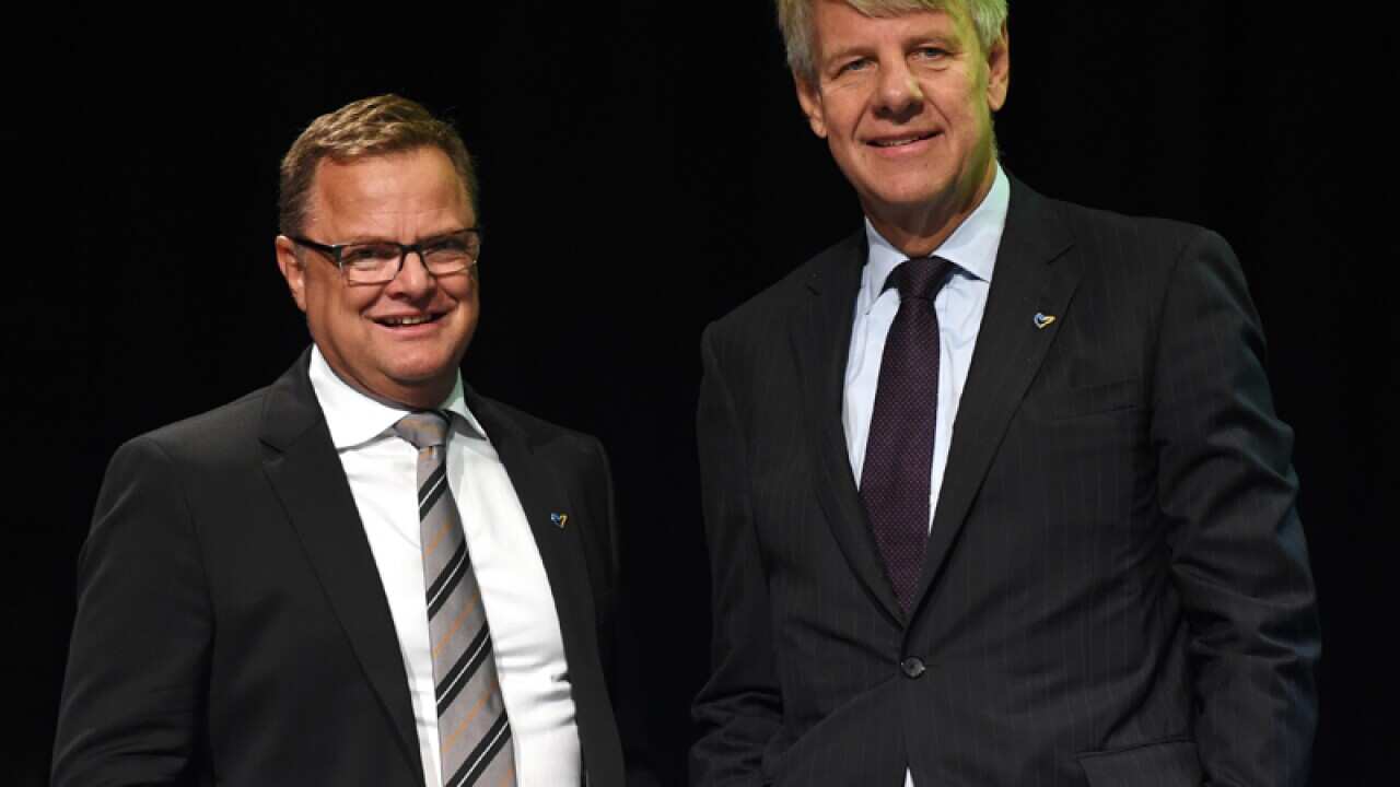 New Bank of Queensland CEO Jon Sutton (L)