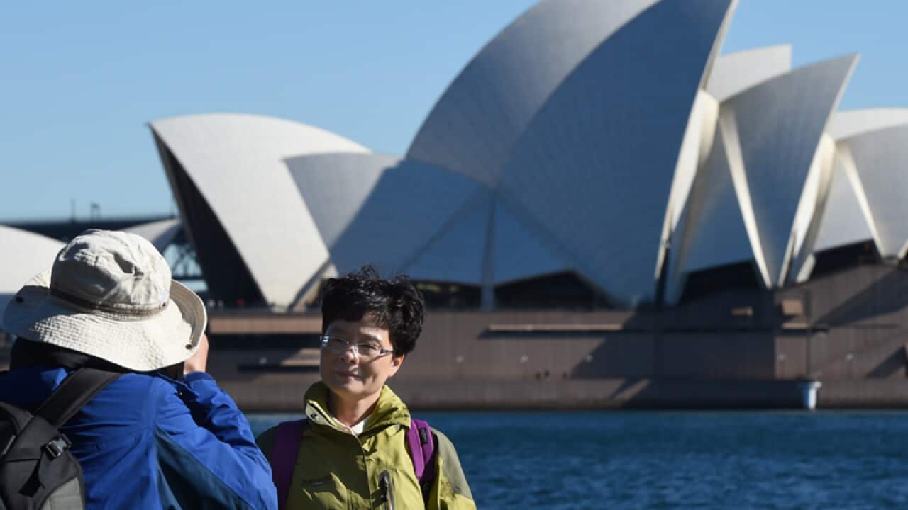 Chinese tourists take in the sites of the Sydney Harbour Bridge