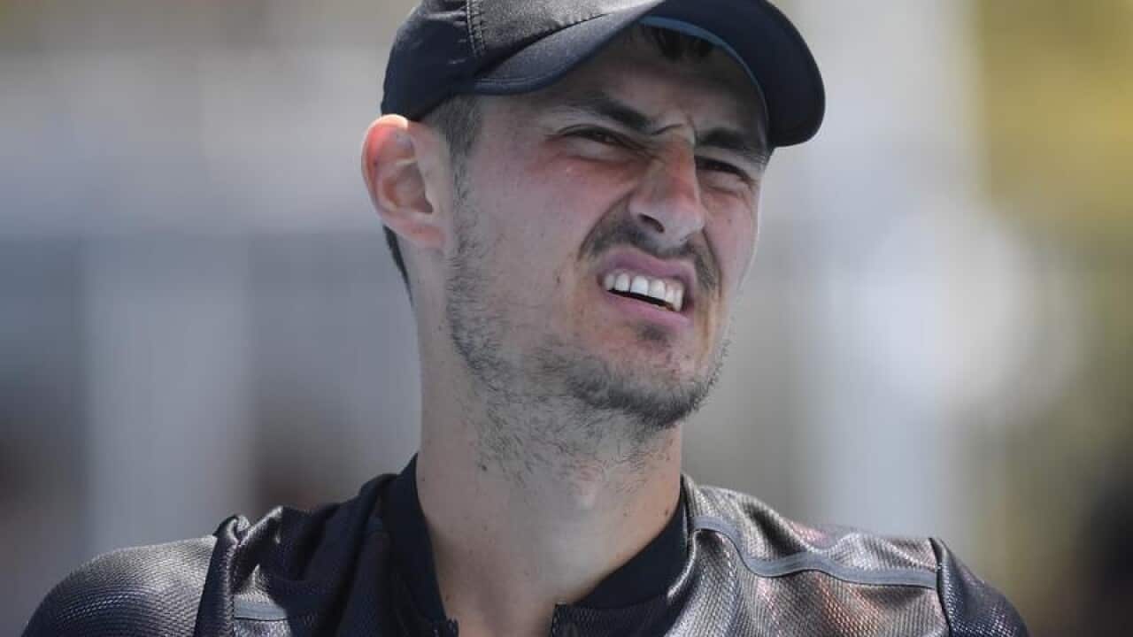 Bernard Tomic of Australia reacts.