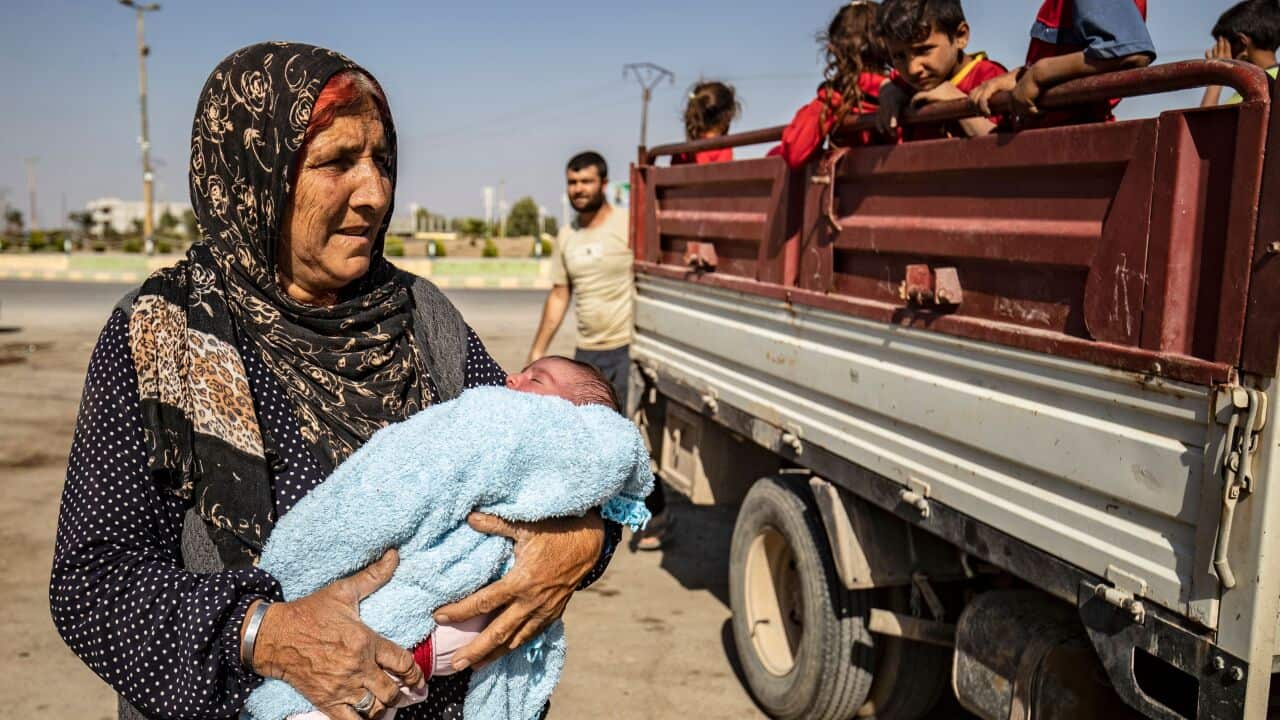 Syrian Arab and Kurdish civilians flee Turkish bombardment this week.