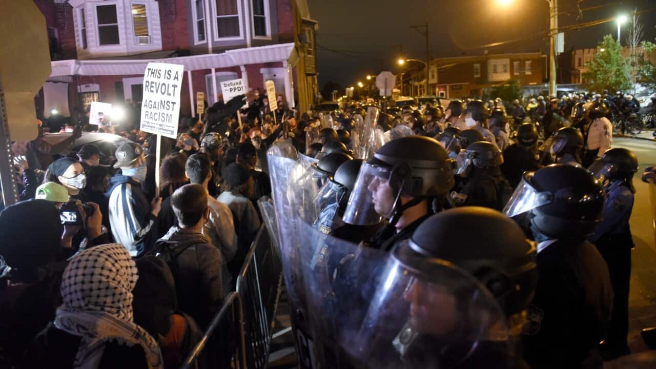 Protesters face off with police during a demonstration Tuesday, Oct. 27, 2020, in Philadelphia. Hundreds of demonstrators marched in West Philadelphia over the death of Walter Wallace Jr., a Black man who was killed by police in Philadelphia on Monday.