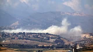 Smoke billows from a mountainous countryside in Lebanon.