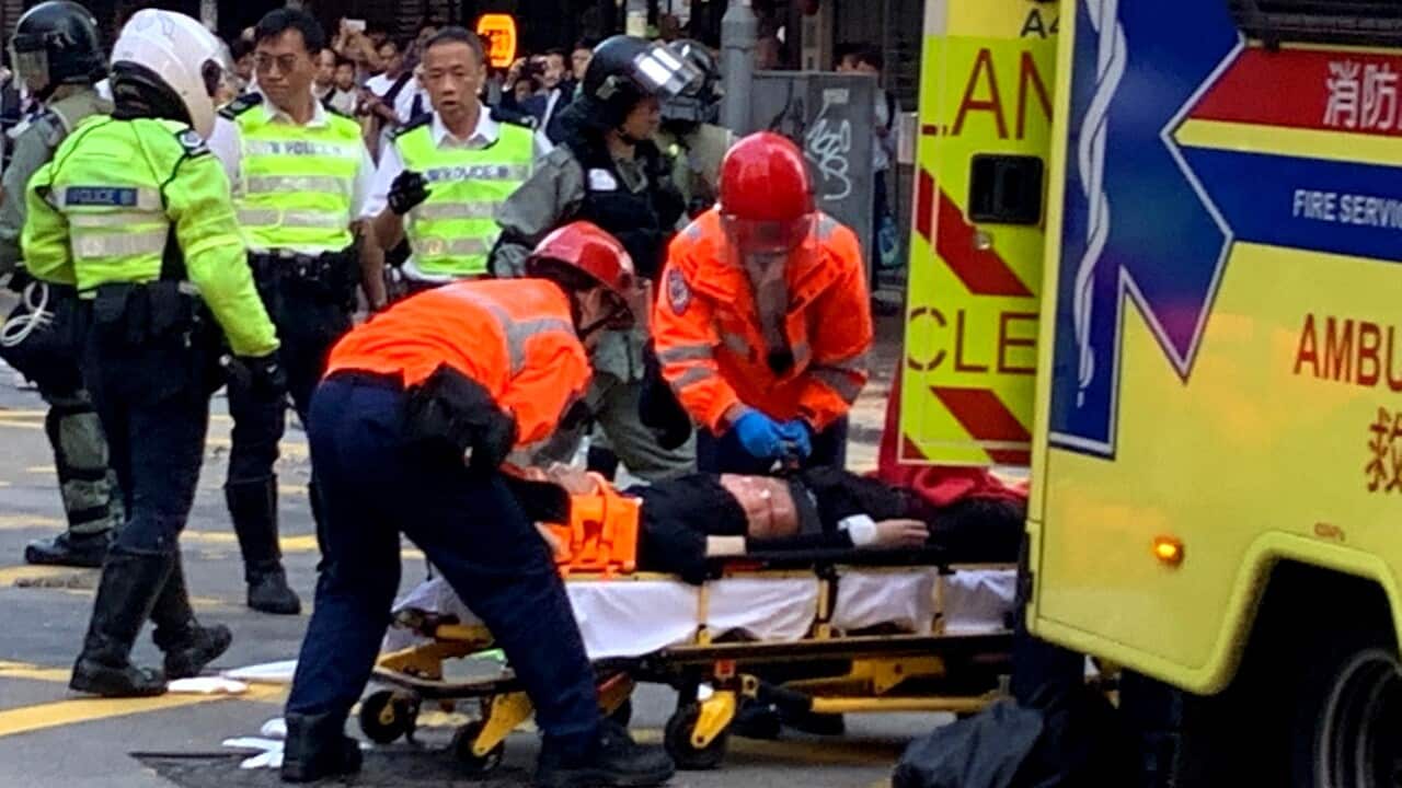 Hong Kong protester shot in street confrontation with police.