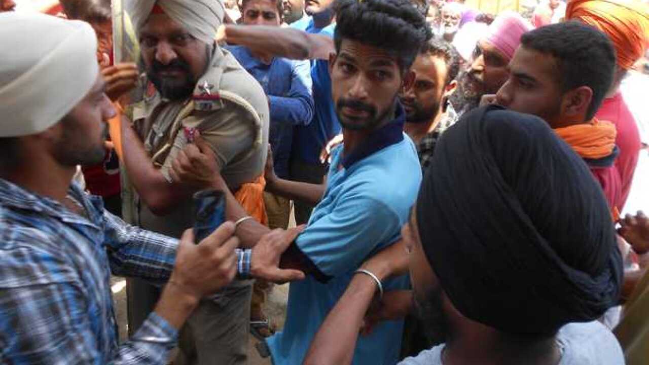 Police officer being beaten up
