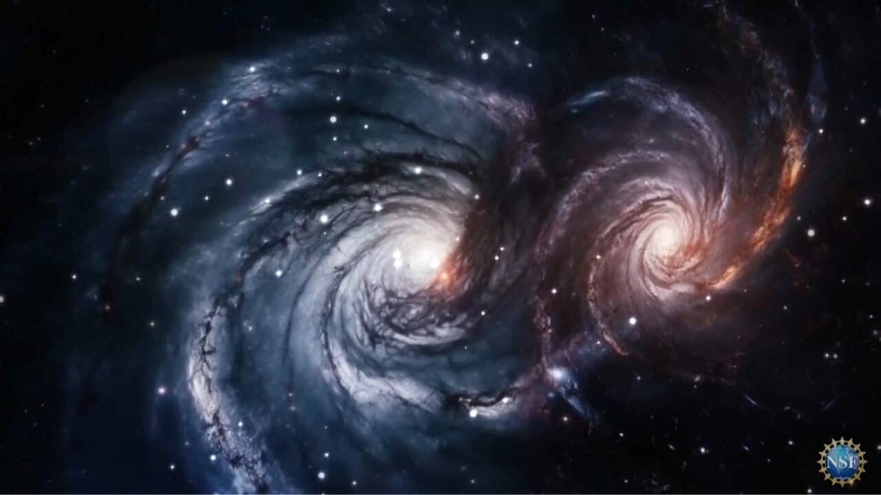 Colliding galaxies are warping space-time here on Earth (Supplied, National Science Foundation).jpg