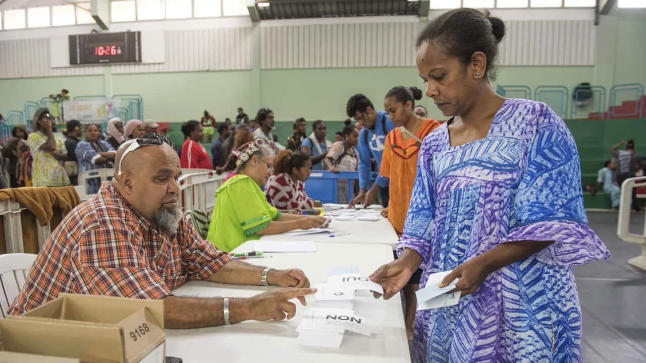 A woman participates in last year's independence referendum in New Caledonia