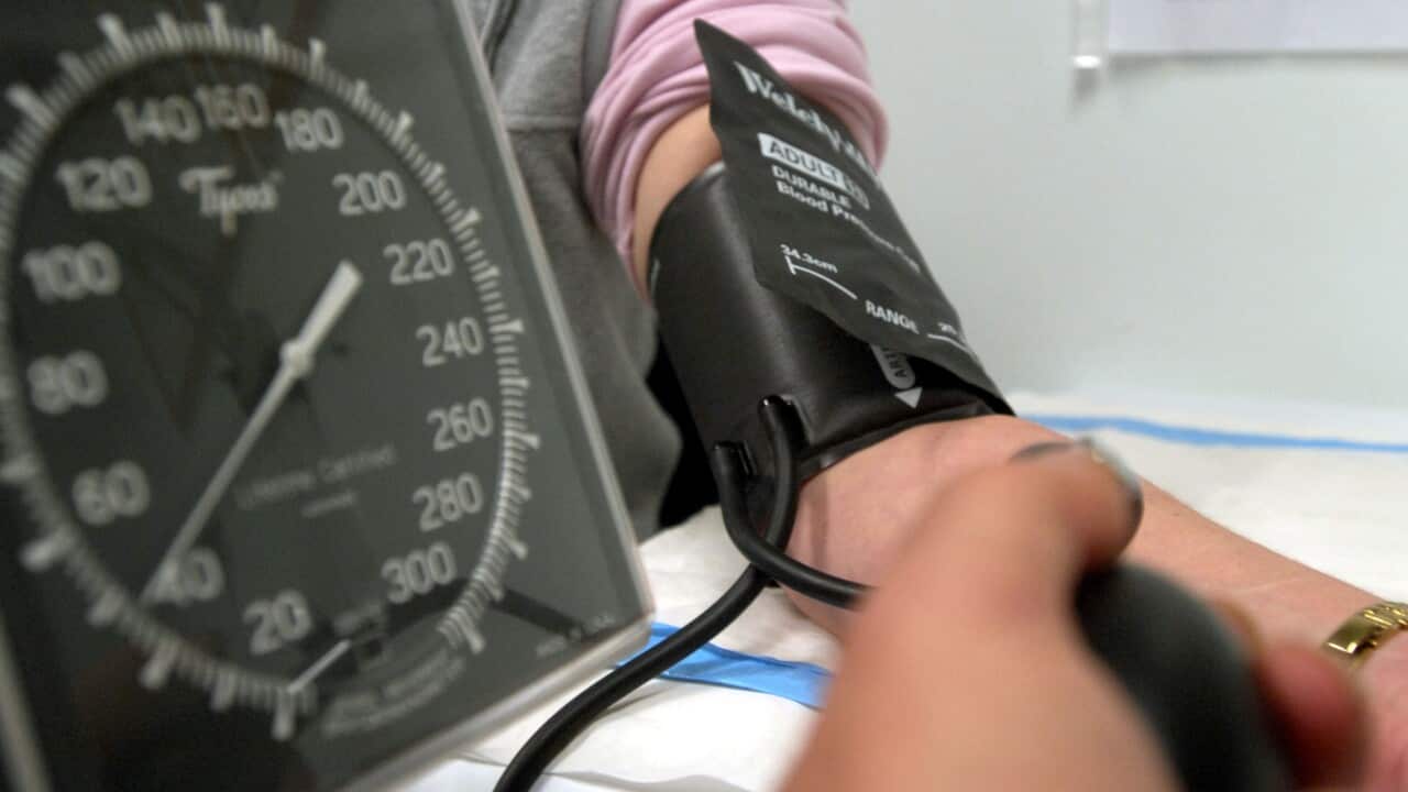 A patient having their blood pressure checked