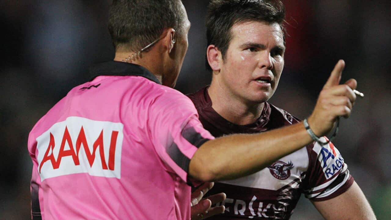 Manly Sea Eagles captain Jamie Lyon speaks to a referee