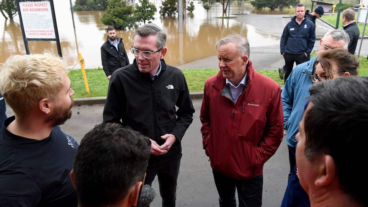NSW Premier Dominic Perrottet (centre left) and Prime Minister Anthony Albanese (centre right) meet SES volunteers in Richmond Sydney (AAP)