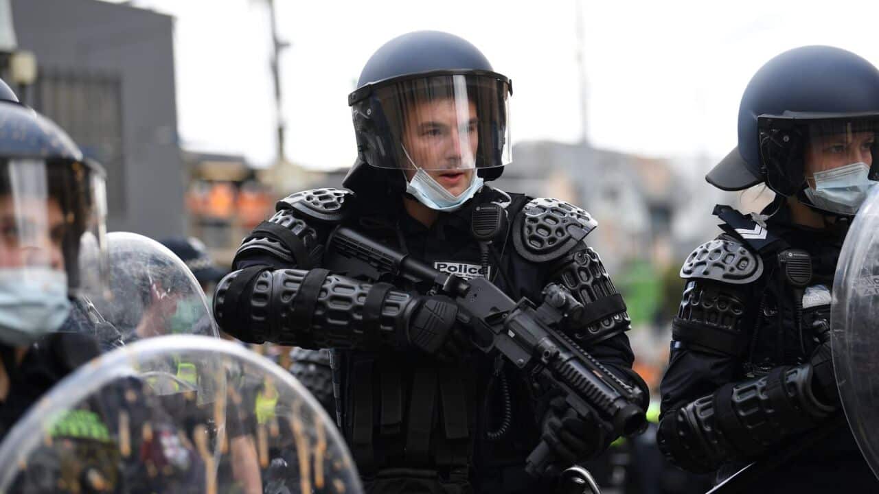 Police are seen in riot gear during an anti-lockdown protest in the central business district of Melbourne