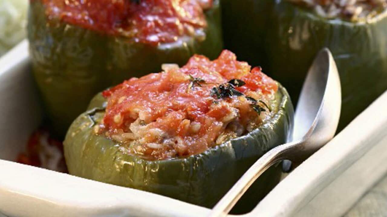 StockFood_00931455 - Three peppers stuffed with tomatoes and rice_1658100885