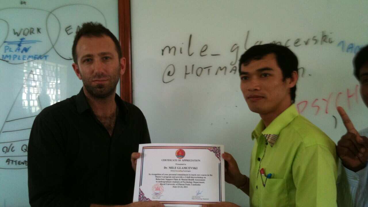 Dr. Mile Glamcevski (L) recieves Certificate of Appreciation at Royal University of Phnom Penh