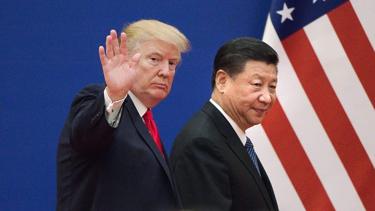 US President Donald Trump (L) and China's President Xi Jinping leave a business leaders event at the Great Hall of the People in Beijing on November 9, 2017.Donald Trump urged Chinese leader Xi Jinping to work "hard" and act fast to help resolve the North