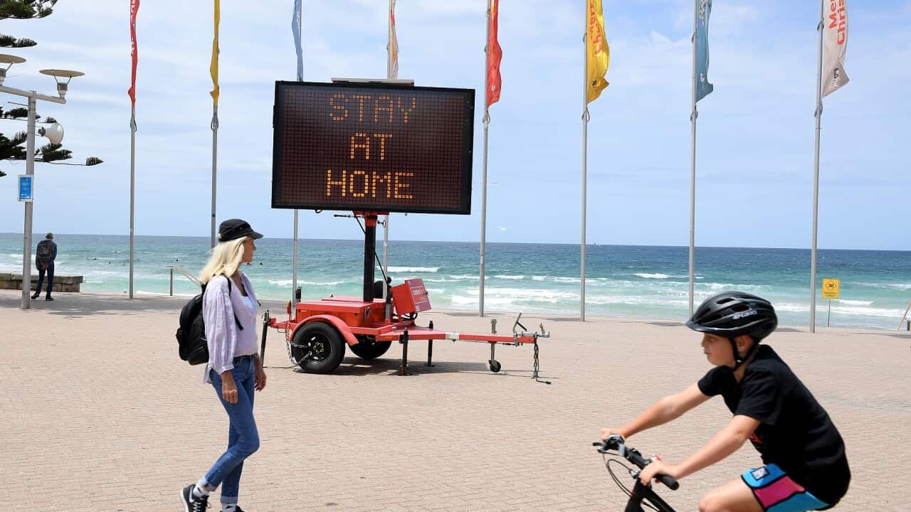 A 'Stay at Home' sign on Manly beach, in Sydney