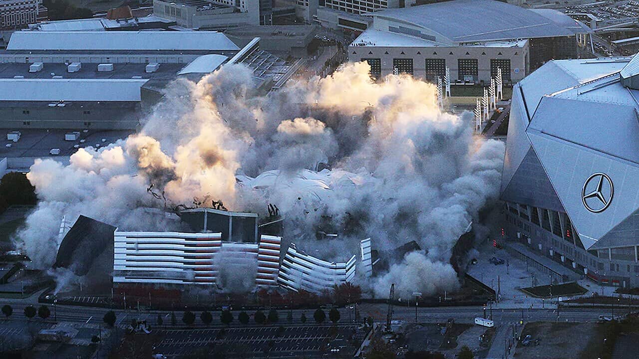 The Georgia Dome comes crumbling down in a ball of dust on Monday, November 20, 2017, in Atlanta.