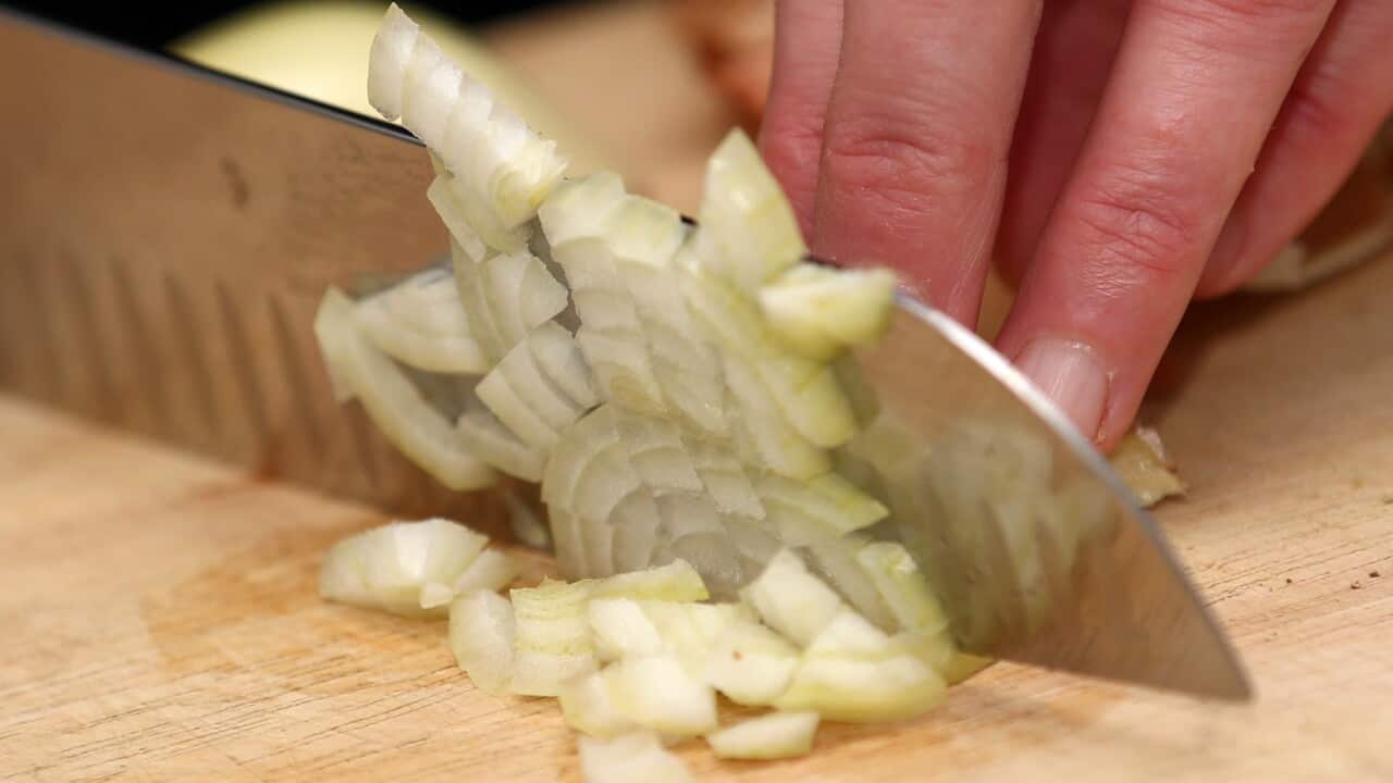 A general view of an onion being cut. Photo credit should read: Tim Goode/PA Wire..