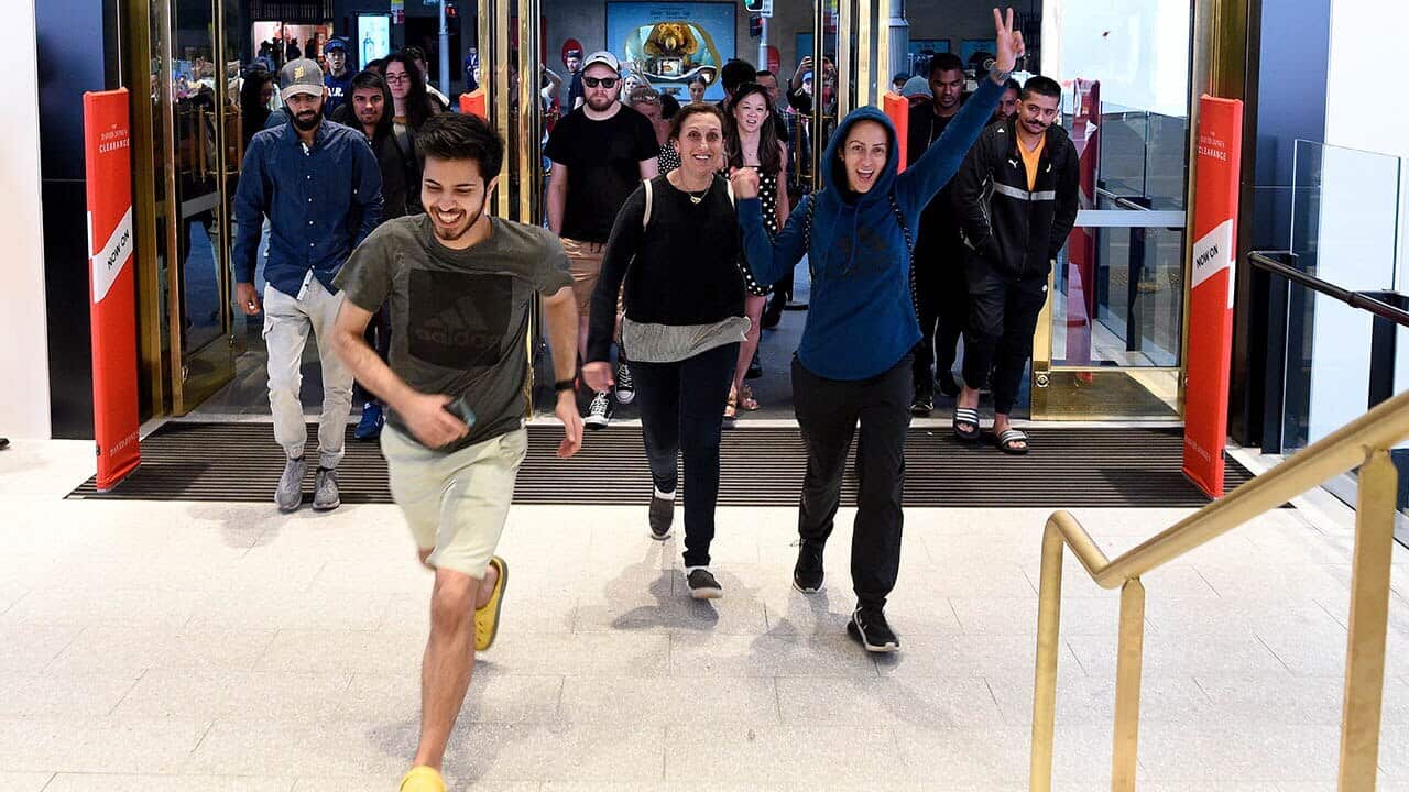The first shoppers enter David Jones' Elizabeth Street store at 6am for Boxing Day sales.