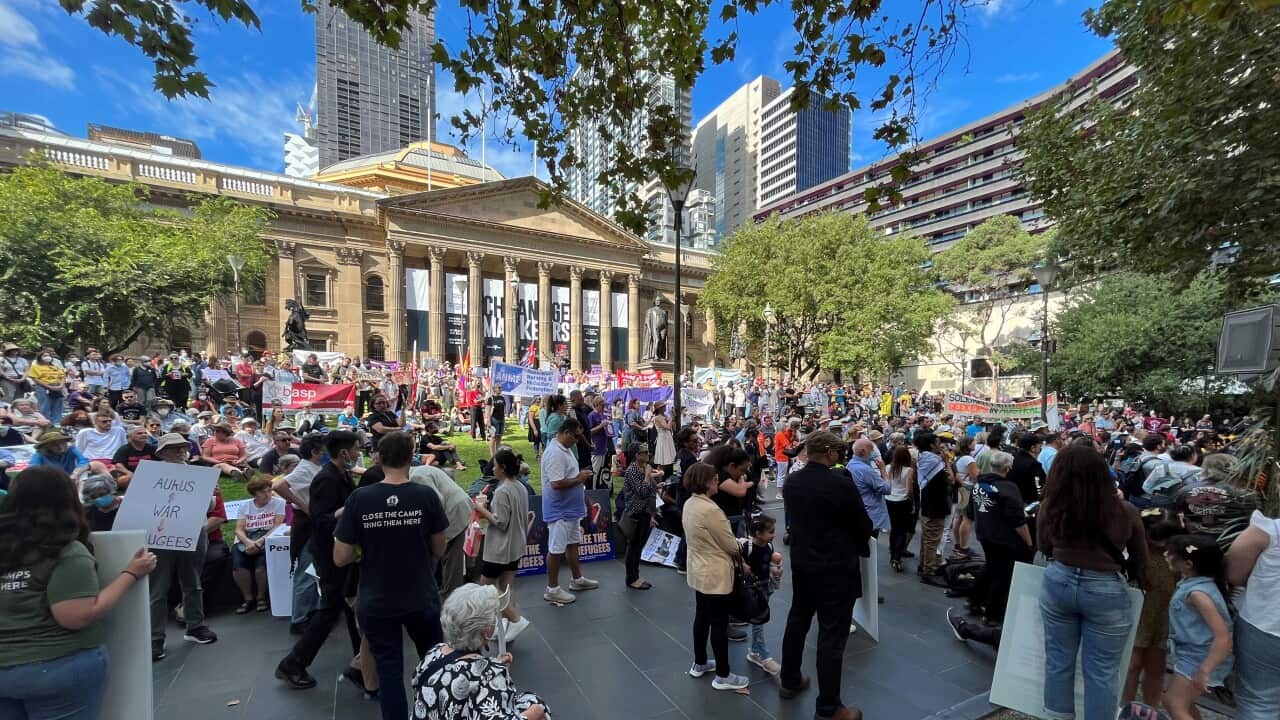 Palm Sunday protesters gather outside the State Library of Victoria.